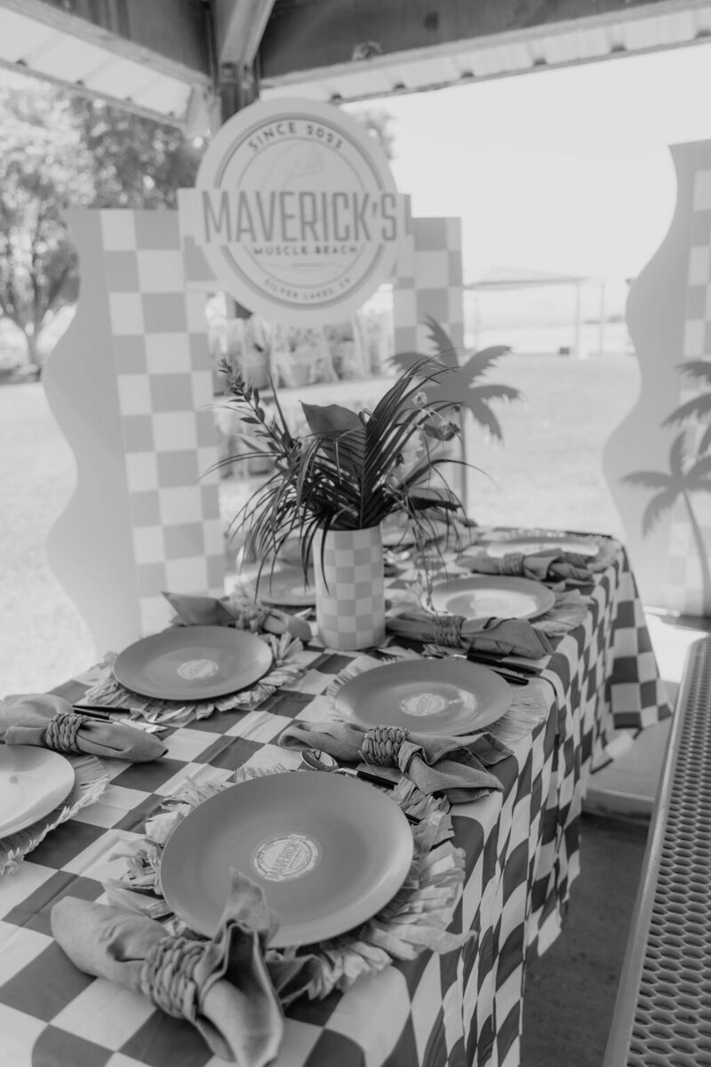 Black and white image of table decor for beach themed birthday party planned by Fancy Chancey in San Diego CA