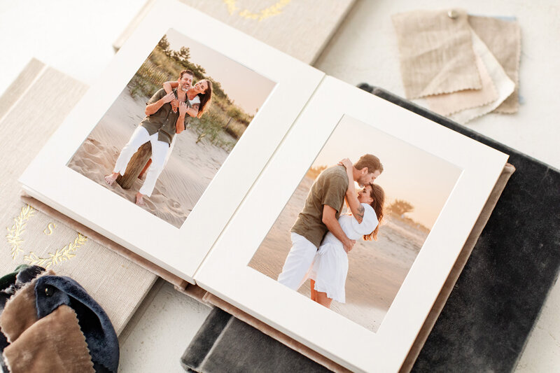 Mockup of a photo album featuring two photos by Cape May photographer, kristi.  Left side of the album is a photo of dad holding young daughter's hand, and right is mom, dad, and daughter standing together in a field of azaleas at Tyler Arboretum