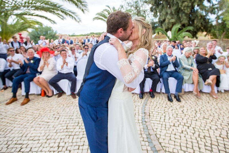 couple kissing at their ceremony