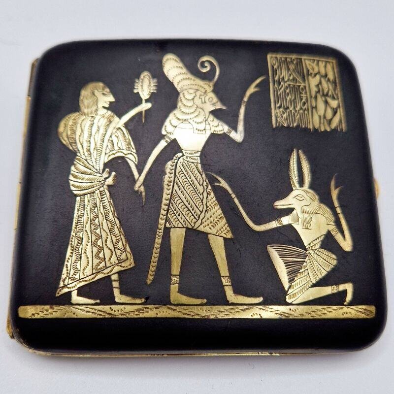 Vintage cigarette case with engraved Egyptian figures in gold on black metal