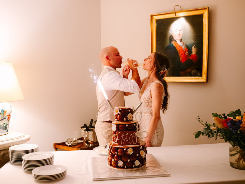 Bride and Groom Crossing Arms and Drinking Champagne