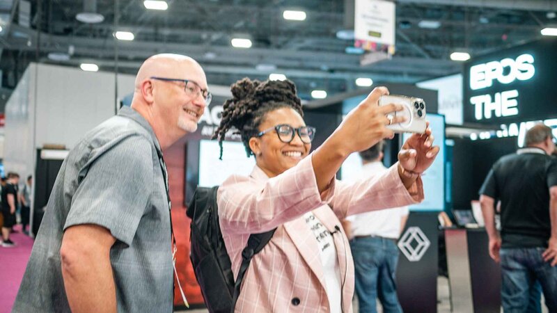 Alesia Hendley taking a selfie with a man on an event