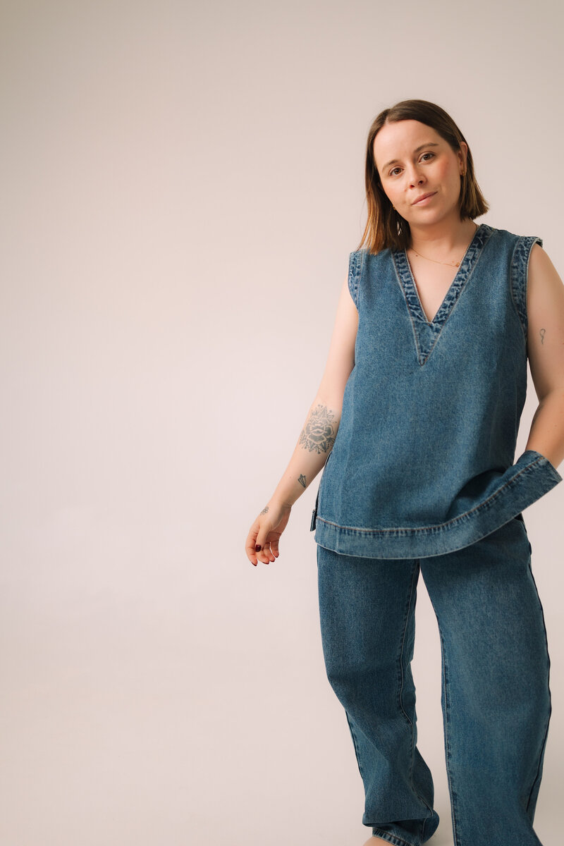 Girl in Maroon jumper reading book with coffee