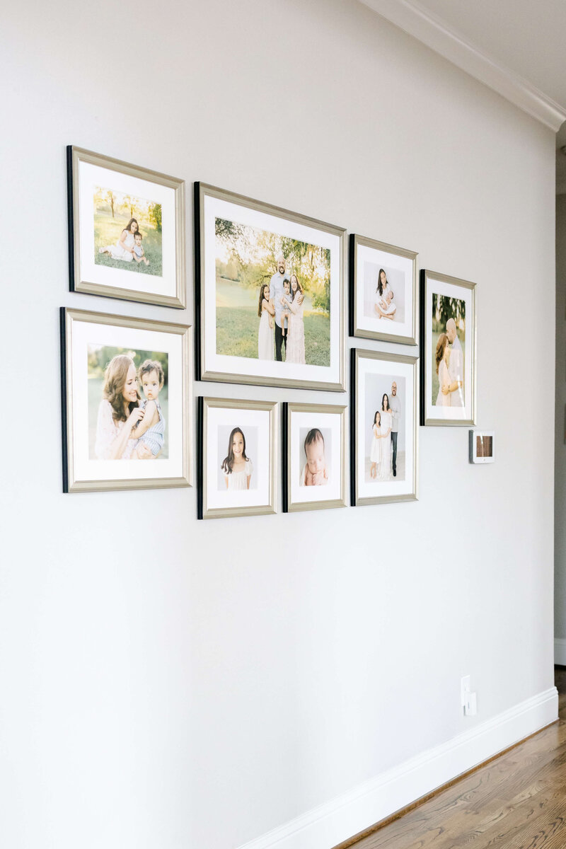large gallery wall of beautiful family portraits