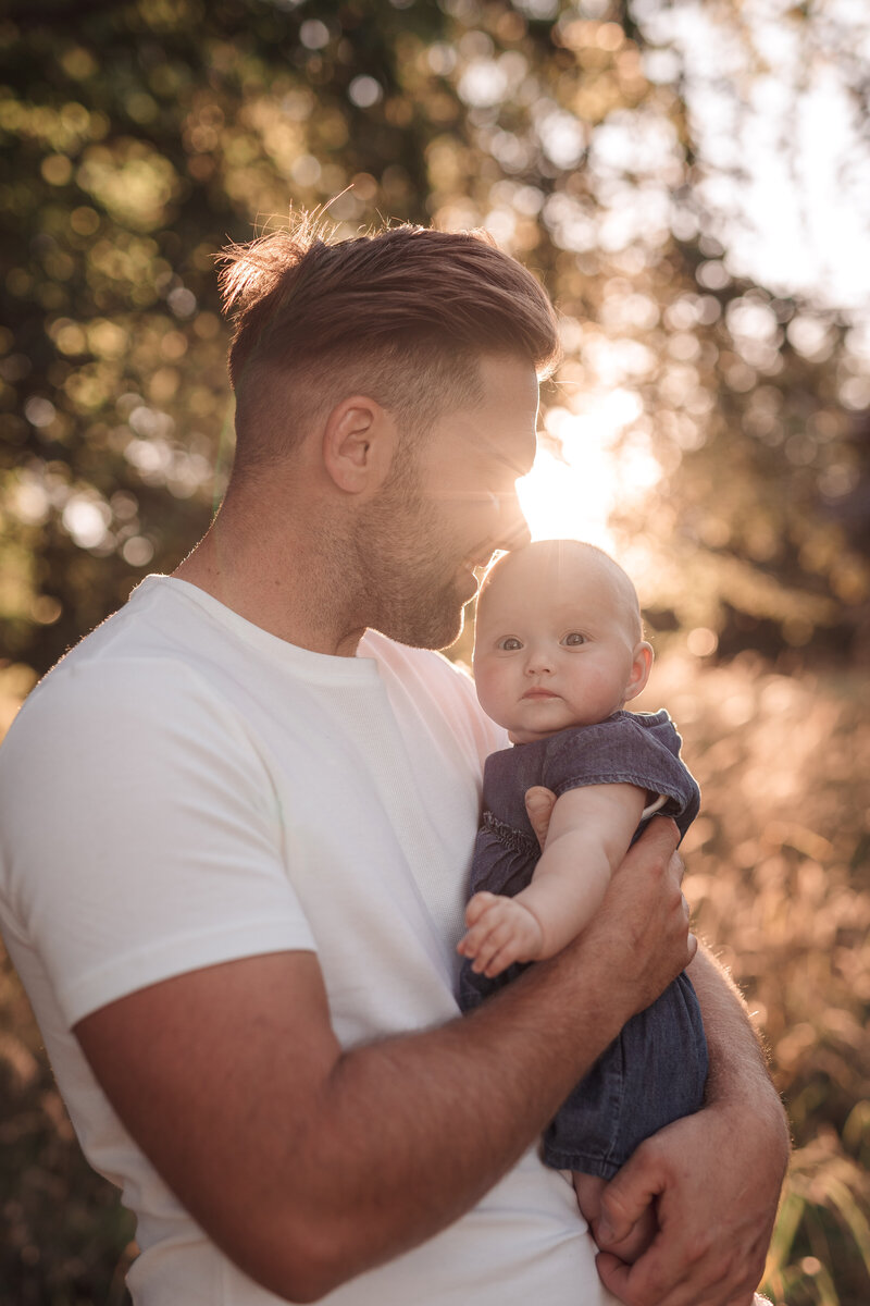 dad and daughter in the evening sun