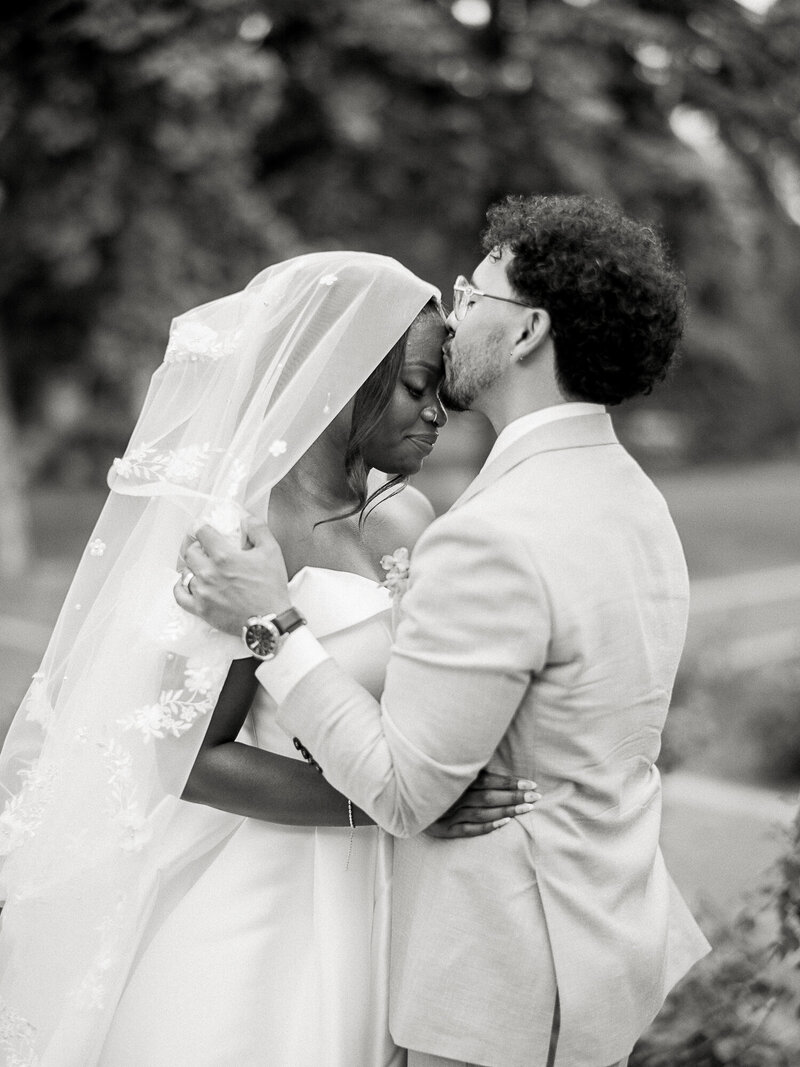 black and white bride and groom at inn on officer's garden