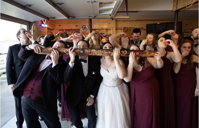 Large wedding party drinking in the garage