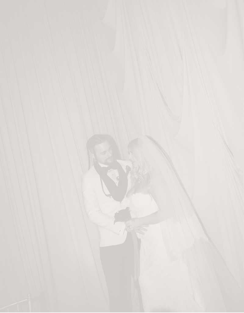 Couple by wedding draping 