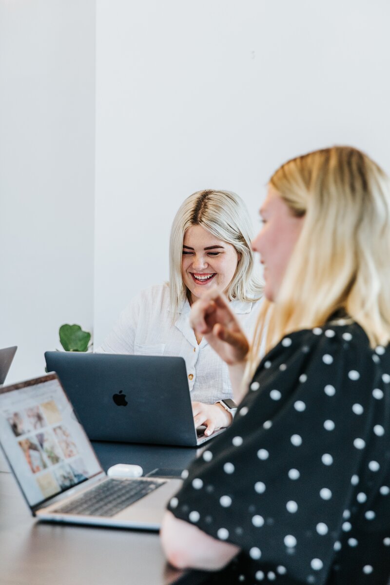 Two women working together on one on one coaching for commercial real estate investing