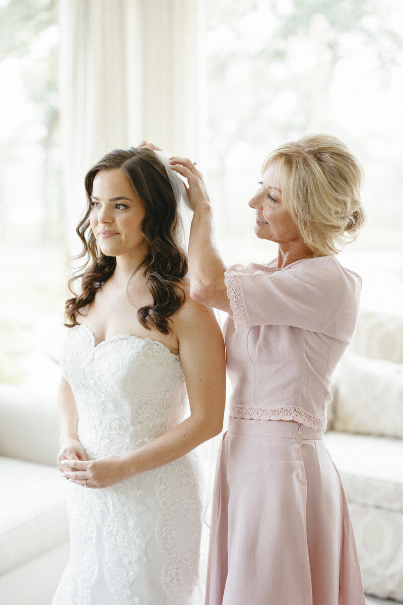 Bride getting ready in Canyonwood Ridge bridal suite with natural light and soft details