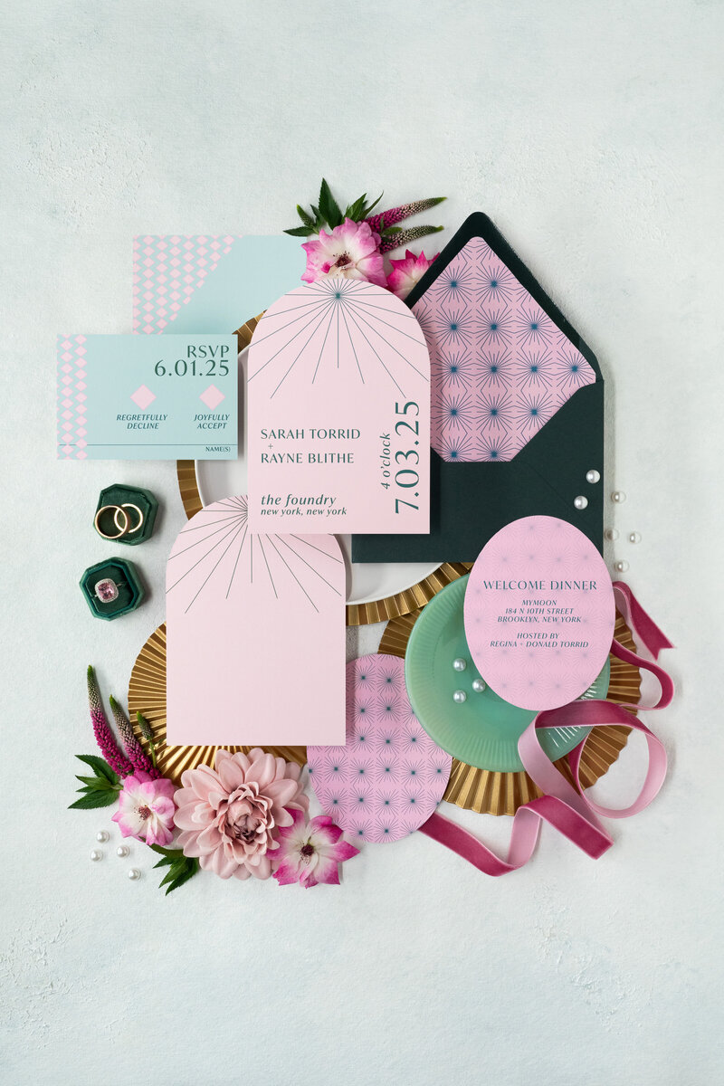 A retro themed wedding invitation suite with record place cards.
