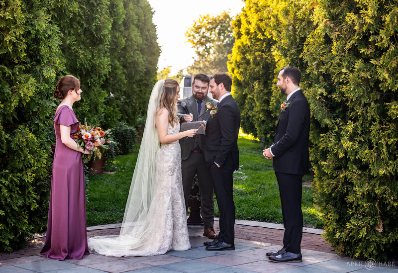 Couple exchange vows in the Romantic Gardens at Denver Botanic Gardens