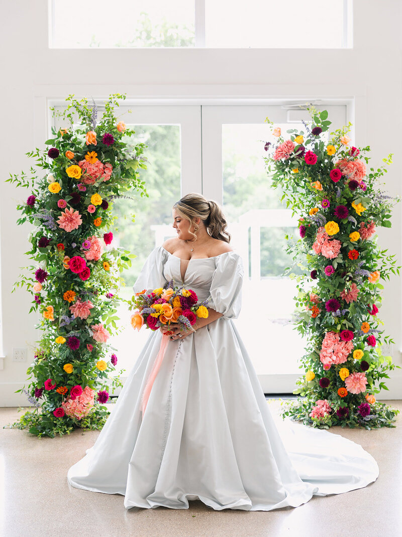 Elegant arch flowers with blush pink garden roses by Kendra’s Events in DFW.