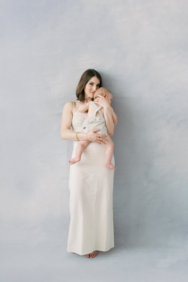 A sweet moment of mom and baby cuddling up during a Dallas portrait photography session.