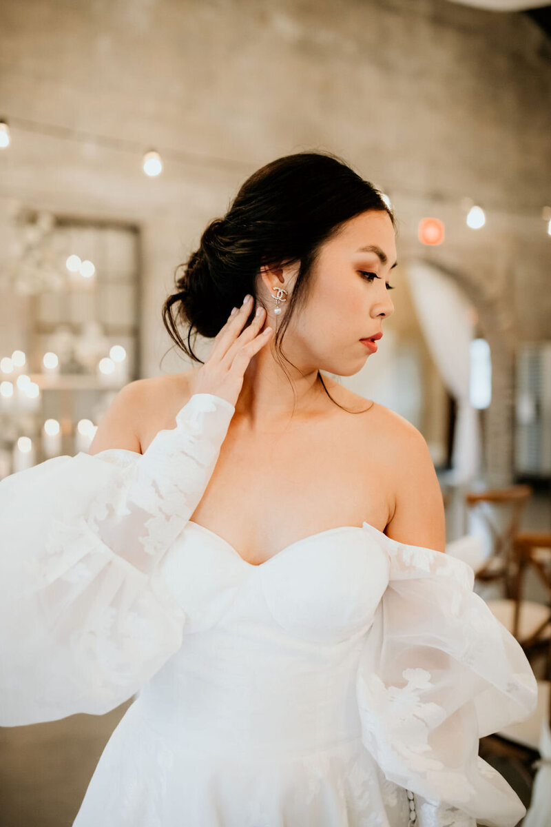 Bridal hairstylist crafts intricate braided hairstyle for romantic wedding look