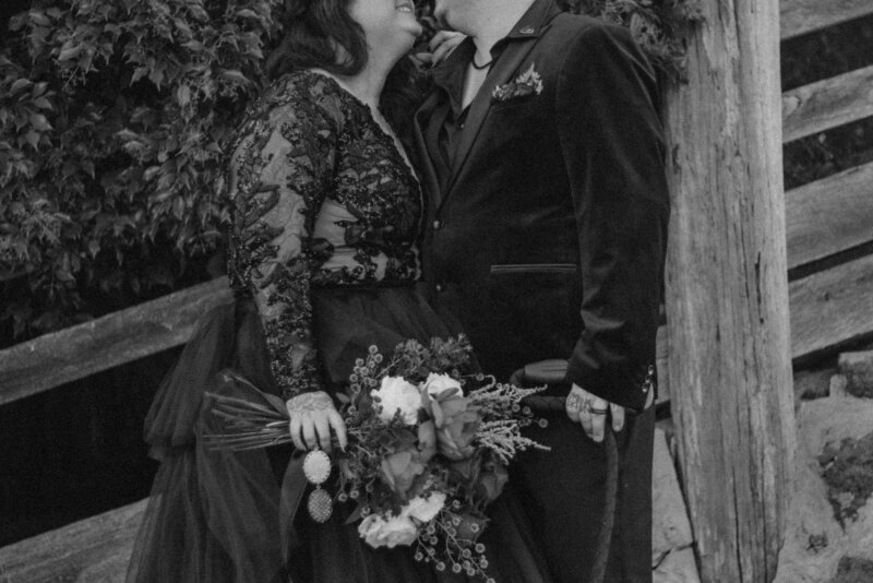 Couple forehead to forehead and nose to nose backlit at the beach
