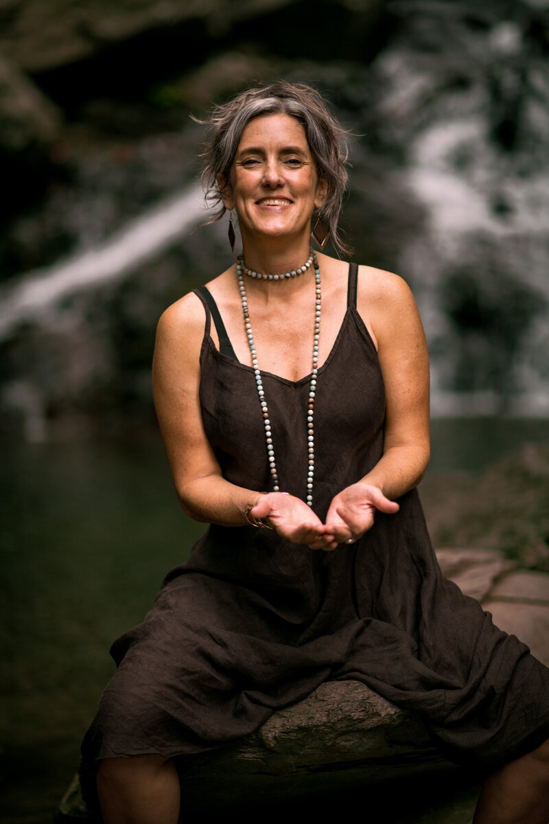 Spiritual mentor Christina Cunningham offering healing guidance outdoors