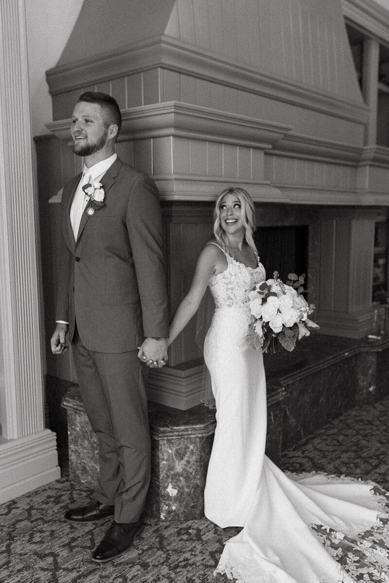 Bride and groom share a heartfelt first touch at The Club at Olde Cypress in Naples, Florida—an intimate wedding moment at a luxury venue, planned by Watters & Co. Events.
