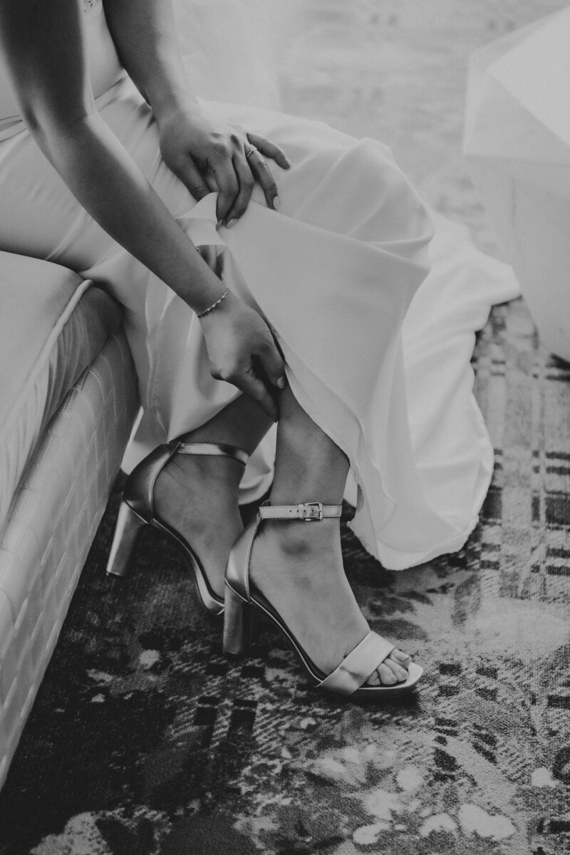 mom helping daughter put on earings