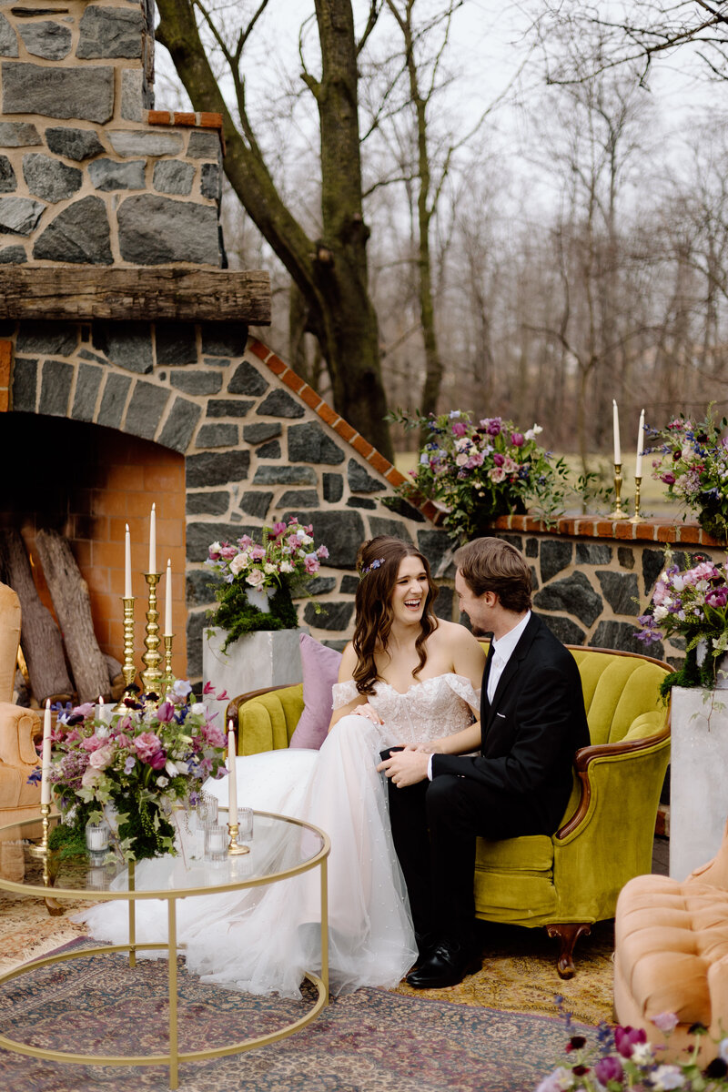 two brides dancing together in a barn