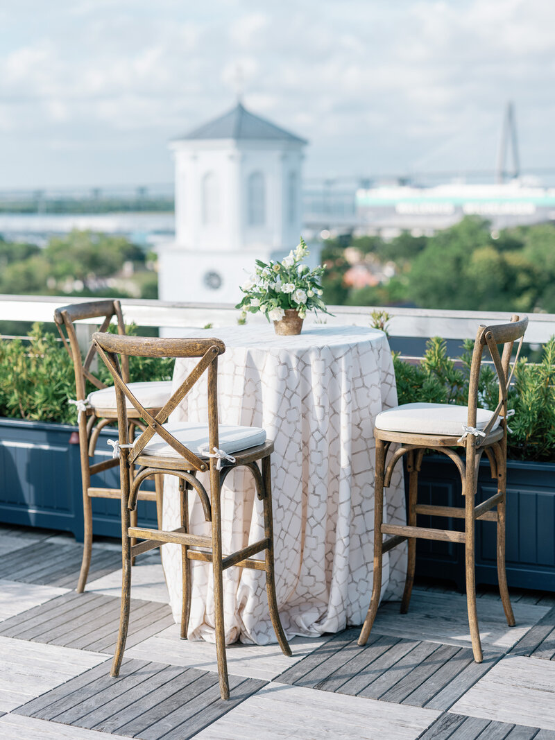 Rooftop wedding rehearsal dinner at the Dewberry Hotel with views of downtown Charleston