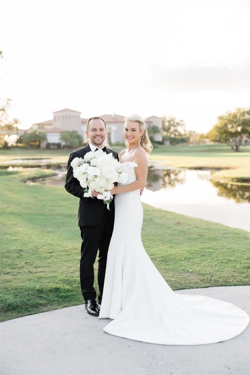 Bride and Groom Portrait on a golf course at the Country Club of Orlando by Orlando wedding photographer