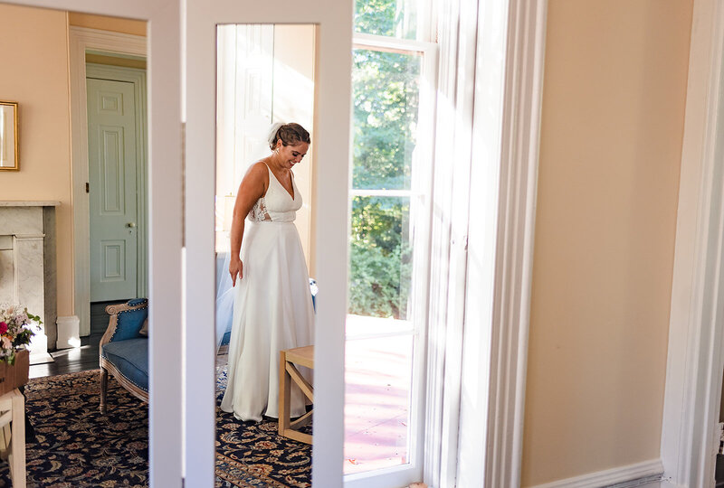 Edith Elan bride wearing in the Iset illusion back wedding dress for her Phoenixville Foundry wedding in Philadelphia, PAnia.
