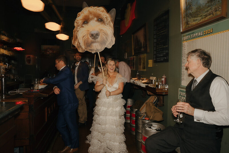 bride taking dog cutout to the dancefloor at the Fitzroy pinnacle