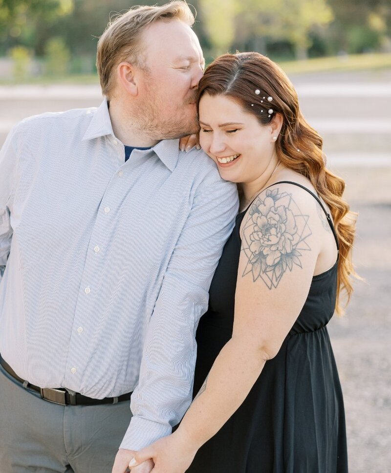 Las Vegas bride with long vintage waves and pearl hair accents by Your Girl Friday LV, smiling with her partner outdoors.