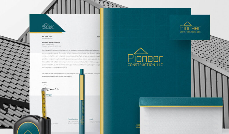 A collage of business stationary items for the brand Pioneer Construction. These items include: letterhead, business card, envelope, folder, pen, and a tape measure.