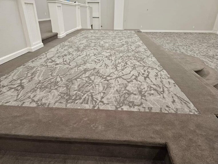 Light gray patterned carpet in a church.