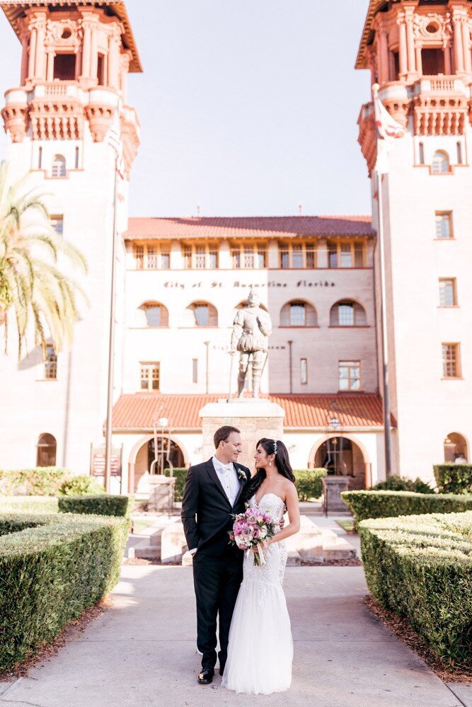 Bride and Groom in front of Treasury Venue historic building in Florida