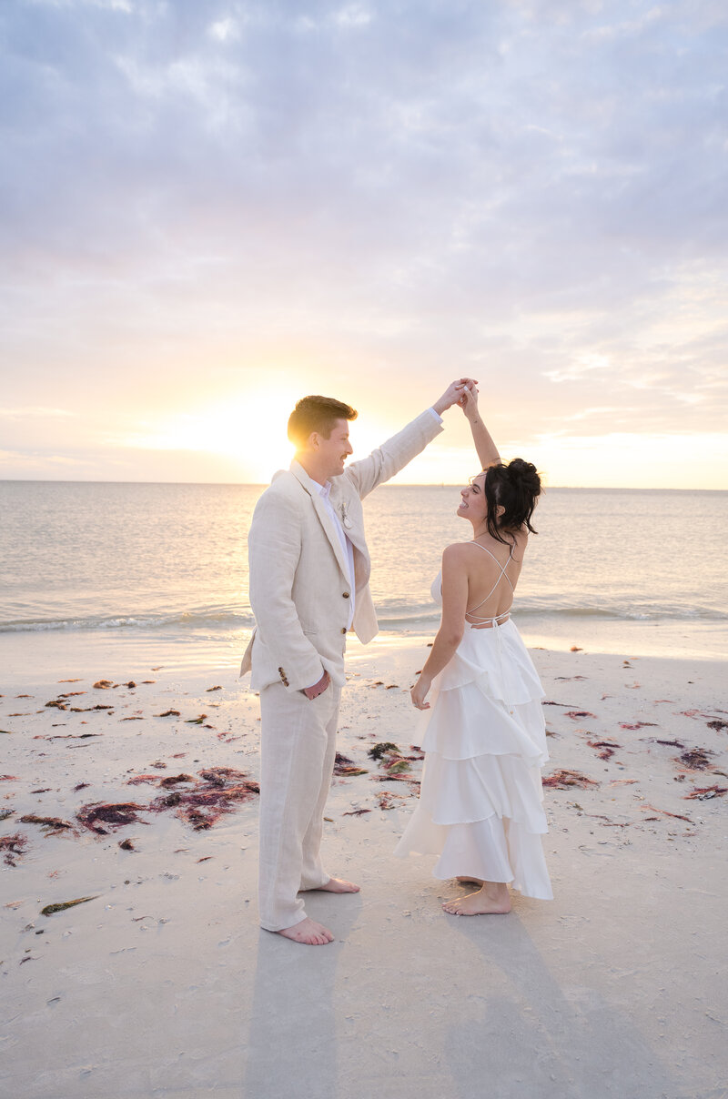 bride holding groom from behind