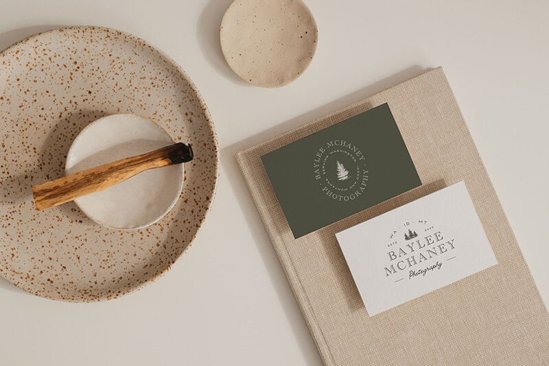 Mockups of logos and cards showing photography branding packages by Palme Design Co