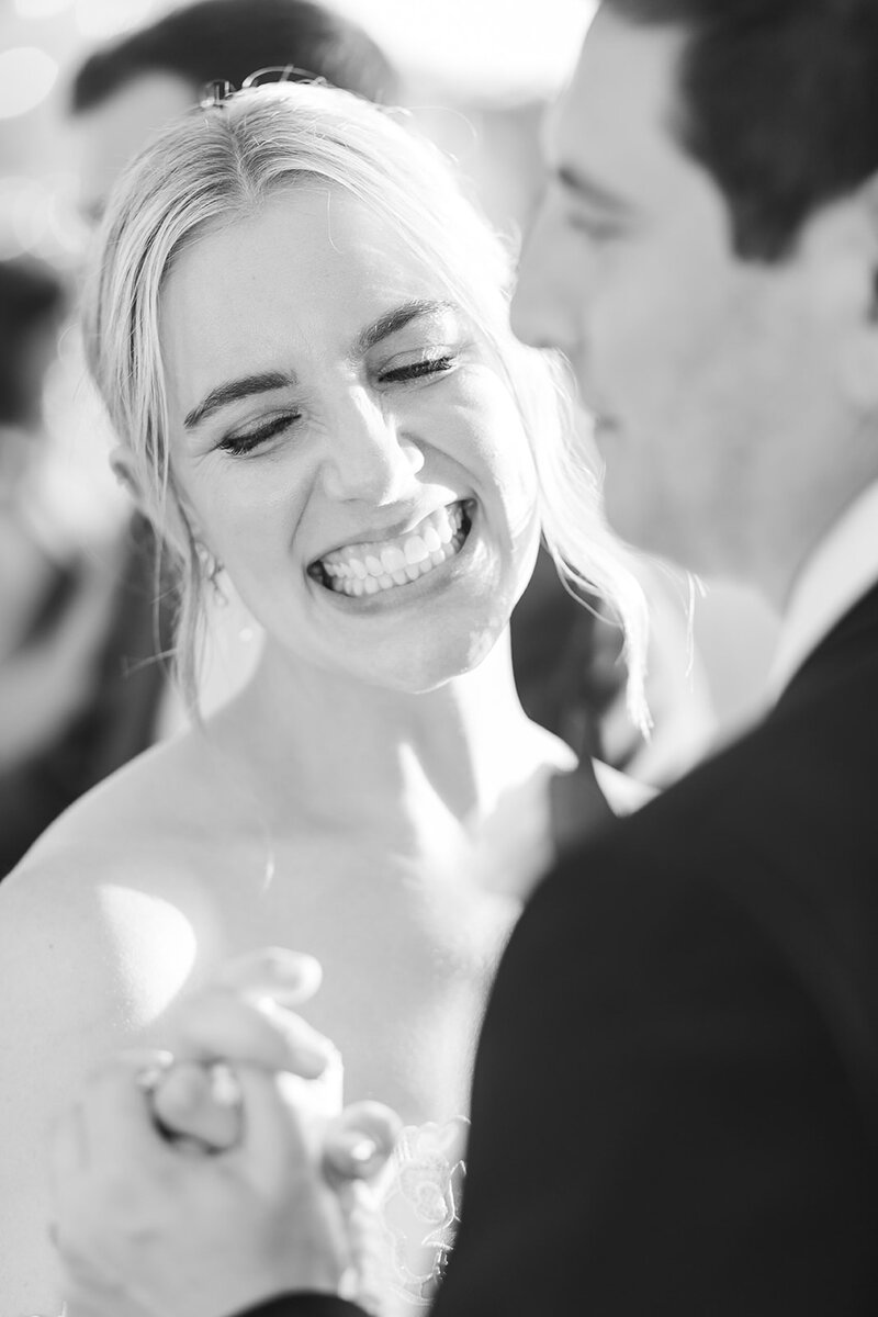 bride laughing on the dance floor