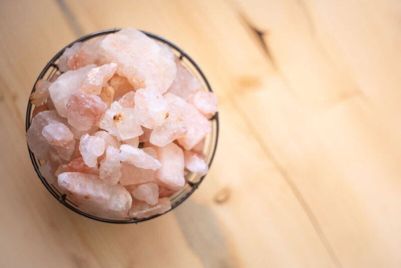 Himalayan salt lamp with salt rocks, representing the grounding energy and calming atmosphere for manifesting inner peace