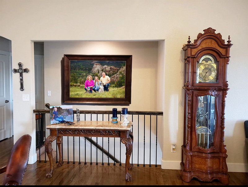 Picture of a framed family photo above a staircase taken in the Medicine Bow National Forest Mountains
