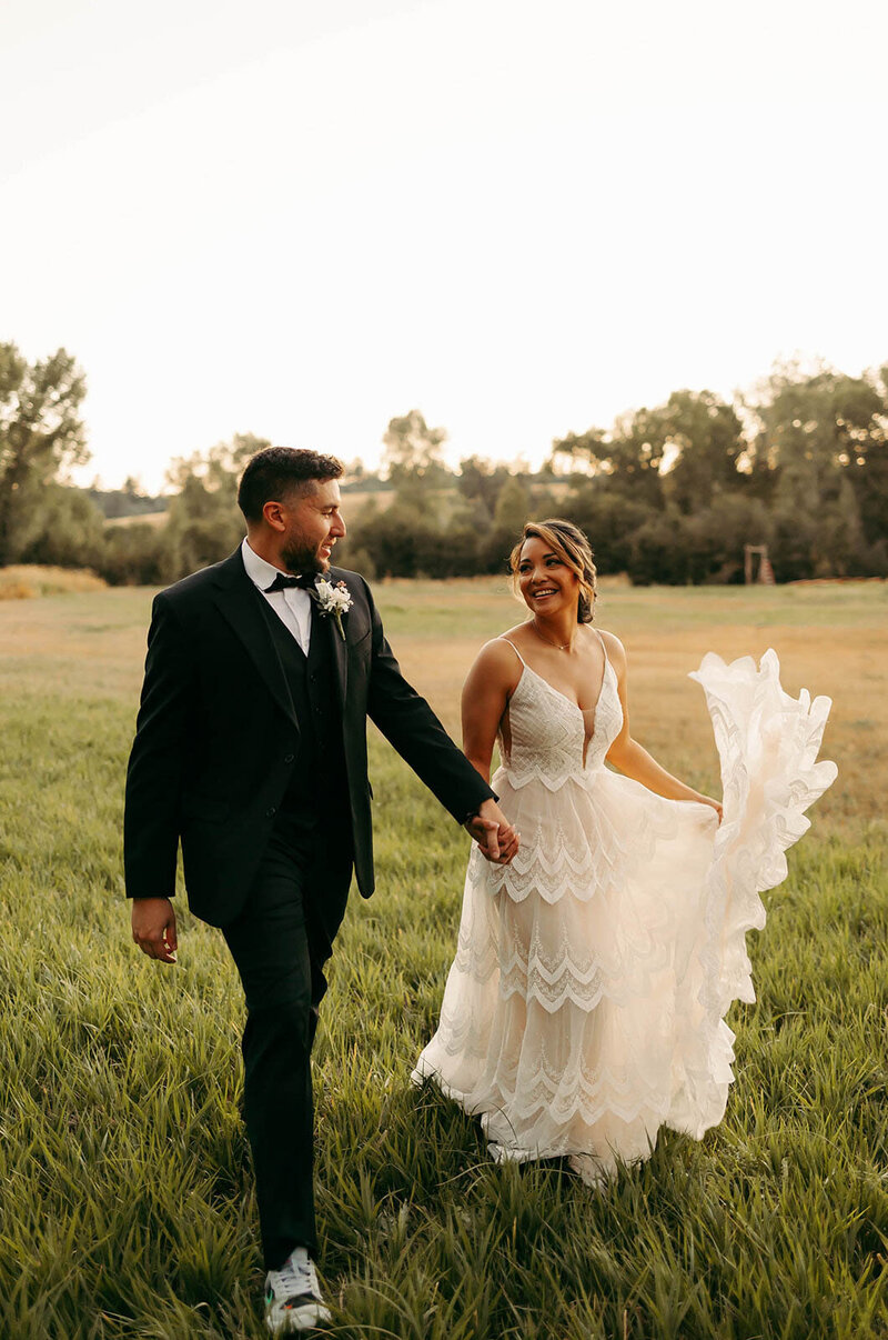 bride and groom at barn wedding venues
