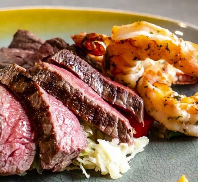 White plate with meat and green beans