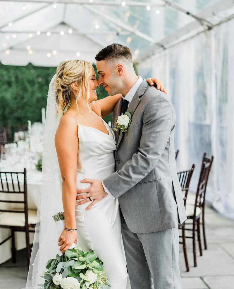 Bride and groom about to kiss on their wedding day