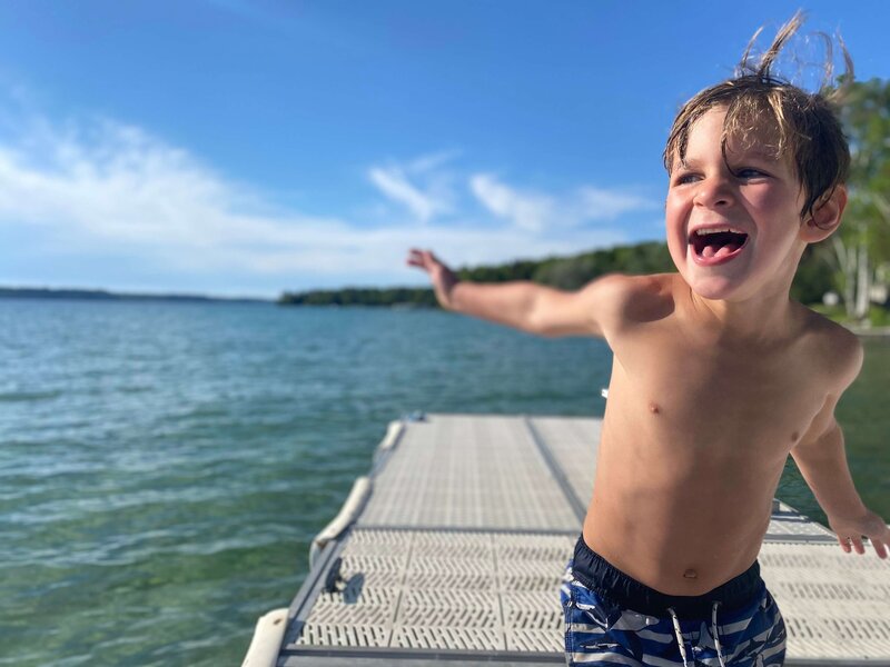 Child playing at lake