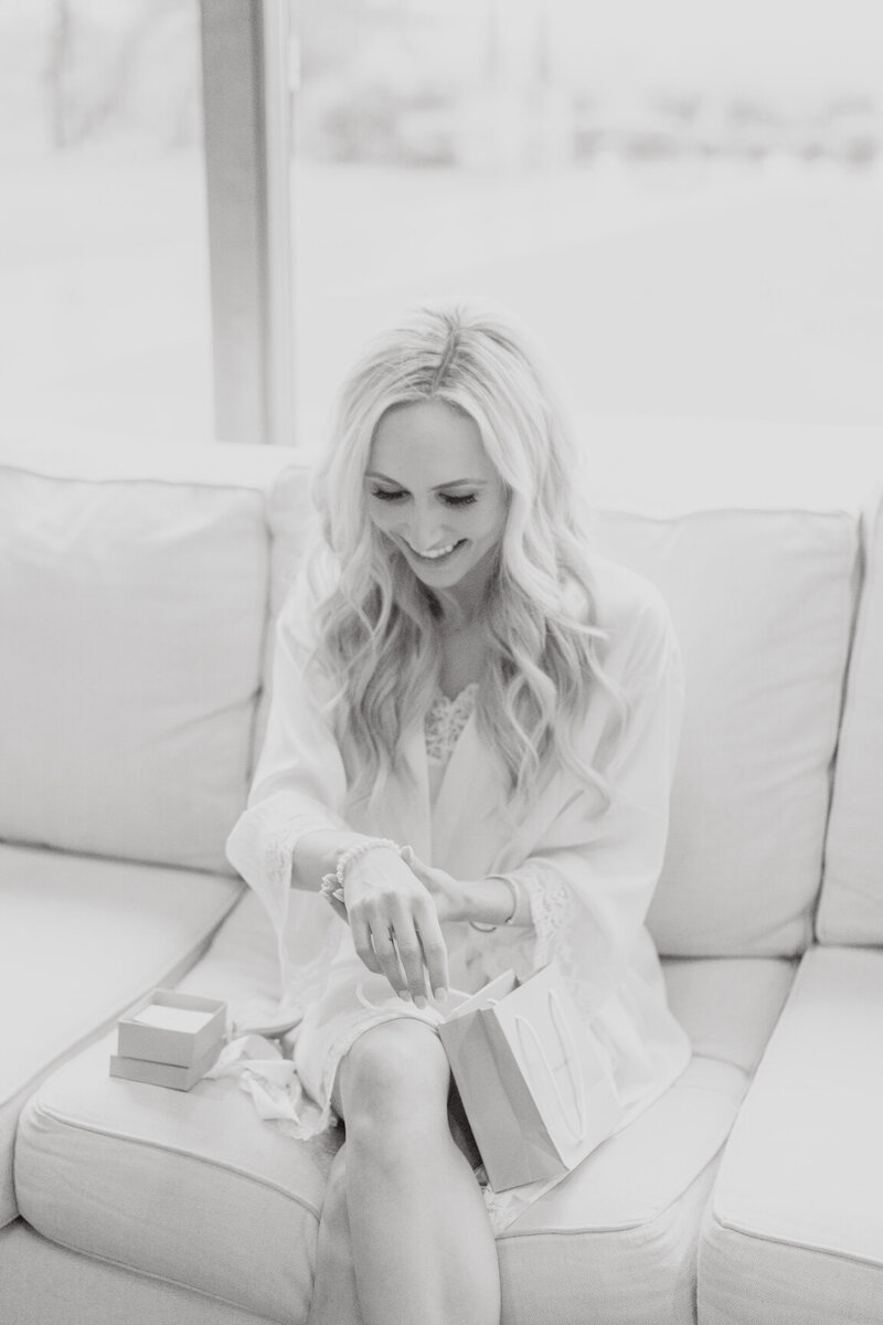Bride getting ready in Canyonwood Ridge bridal suite with natural light and soft details
