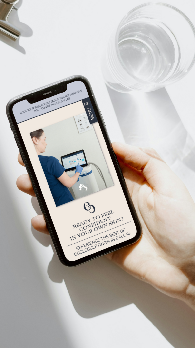 Cellphone displaying mobile-optimized homepage for full brand and website design services for small businesses.