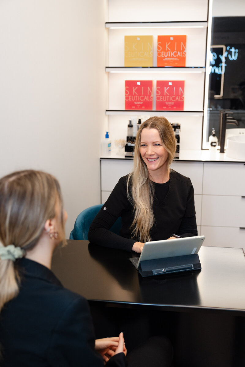 A client in a consultation with a professional at a medical aesthetical clinic called Project Skin MD, Ottawa.