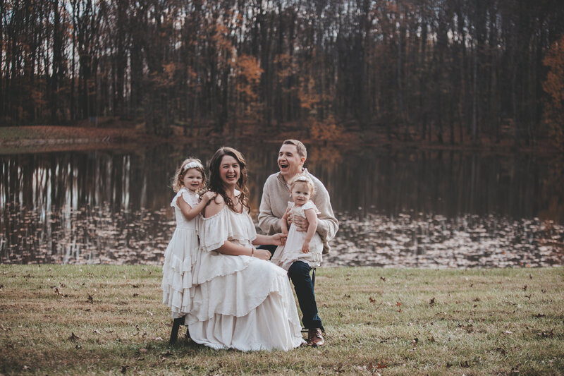 Family Portrait of young family with toddlers laughing and having fun