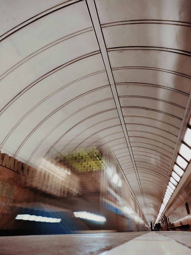 Motion-blurred subway rushing through a tunnel, symbolizing diagnosing hidden organizational patterns and fast-moving issues.