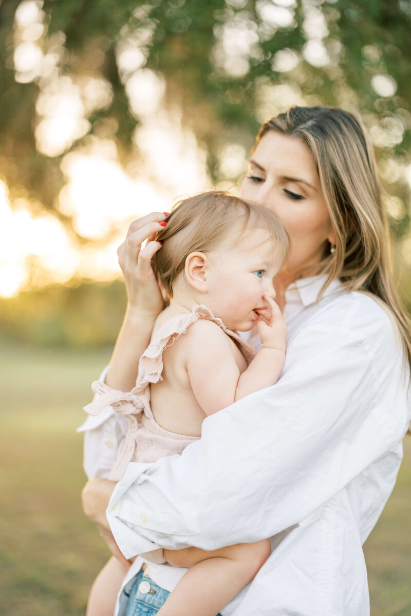 a mom holding her baby