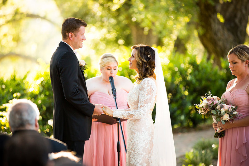 bride and groom saying their vows to each other