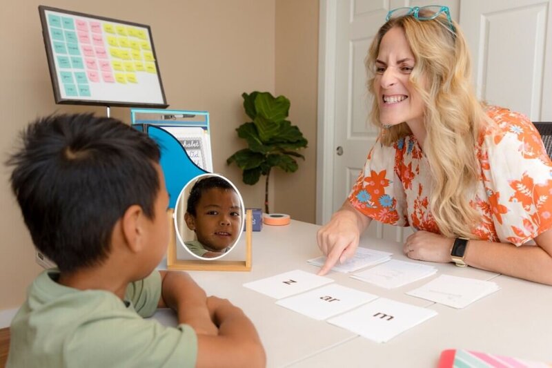 Orton-Gillingham tutoring session with alphabet cards to practice sounds