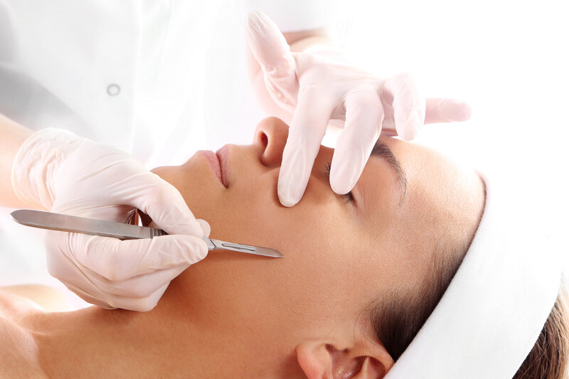 Professional dermaplaning session removing dead skin cells and peach fuzz in Richmond, VA